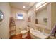 Cozy bathroom with pedestal sink and decorative accents, a warm and inviting space at 1009 Leigh Ave, Charlotte, NC 28205