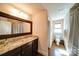 Bathroom with granite countertop and large framed mirror at 1009 Leigh Ave, Charlotte, NC 28205