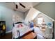 Charming bedroom with sloped ceiling, hardwood floors, and a teepee at 1009 Leigh Ave, Charlotte, NC 28205