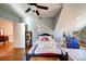 Bedroom with sloped ceiling, hardwood floors and door to hallway at 1009 Leigh Ave, Charlotte, NC 28205