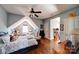 Charming bedroom with sloped ceiling, hardwood floors, and ample natural light at 1009 Leigh Ave, Charlotte, NC 28205