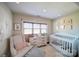 Adorable Bedroom with a white crib and neutral decor at 1009 Leigh Ave, Charlotte, NC 28205