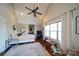 Cozy bedroom features a ceiling fan, a window, and a decorative rug at 1009 Leigh Ave, Charlotte, NC 28205
