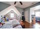 Charming bedroom with sloped ceiling, hardwood floors, and ample natural light at 1009 Leigh Ave, Charlotte, NC 28205