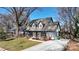 Charming home featuring a welcoming front porch, three dormers and a well-maintained lawn at 1009 Leigh Ave, Charlotte, NC 28205