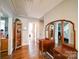 Hallway features hardwood floors, decorative shelves, and mirrors at 1009 Leigh Ave, Charlotte, NC 28205
