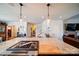 Large island with stovetop, open to the living room and staircase at 1009 Leigh Ave, Charlotte, NC 28205