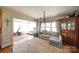 Inviting living room features a cozy couch, bright windows and opens to the exercise room at 1009 Leigh Ave, Charlotte, NC 28205