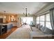 Open-concept living area with hardwood floors, and access to the kitchen and other spaces at 1009 Leigh Ave, Charlotte, NC 28205