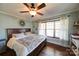 Comfortable main bedroom features a ceiling fan, neutral paint and hardwood floors at 1009 Leigh Ave, Charlotte, NC 28205