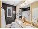 Bathroom featuring a granite countertop vanity, modern fixtures, and a decorative accent wall at 1016 Secretariat Dr, York, SC 29745