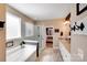 Bathroom featuring a tub and glass enclosed shower, with double granite vanity at 1016 Secretariat Dr, York, SC 29745