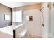 Modern bathroom featuring a glass-enclosed shower with white subway tile and a pebble floor at 1016 Secretariat Dr, York, SC 29745