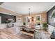 Elegant dining room with hardwood floors, stylish light fixture, and modern table setting at 1016 Secretariat Dr, York, SC 29745