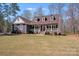 Charming home featuring a manicured lawn, inviting front porch and dormer windows at 1016 Secretariat Dr, York, SC 29745