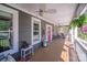 Charming front porch with wooden deck, red door, and decorative accents at 1016 Secretariat Dr, York, SC 29745