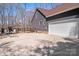 Exterior showcasing attached garage, fenced yard, with a shed and additional parking at 1016 Secretariat Dr, York, SC 29745