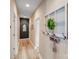 Hallway with light wood floors, fresh neutral paint, and decorative vintage window element with hooks at 1016 Secretariat Dr, York, SC 29745