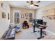 Bright office space with a ceiling fan and ample natural light from the two large windows at 1016 Secretariat Dr, York, SC 29745