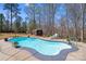 In-ground pool area with mature landscaping and a shed in a private backyard setting at 1016 Secretariat Dr, York, SC 29745