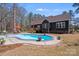 Backyard pool area features mature landscaping, patio space, and outdoor seating at 1016 Secretariat Dr, York, SC 29745