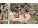 Overhead shot of home on lot with paved driveway and treed surroundings at 102 Kerda St, Taylorsville, NC 28681