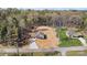 Aerial view of two residences nestled within a vast, verdant landscape, showcasing the property's serene location at 102 Kerda St, Taylorsville, NC 28681