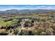 A beautiful aerial view highlights homes surrounded by lush greenery and mountains at 102 Kerda St, Taylorsville, NC 28681