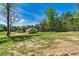Expansive backyard with lush greenery and mature trees, offering a serene outdoor retreat at 102 Kerda St, Taylorsville, NC 28681