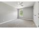 Bright bedroom featuring neutral walls, plush carpeting, and a ceiling fan at 102 Kerda St, Taylorsville, NC 28681