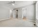 Bright bedroom with neutral carpet and multiple closets at 102 Kerda St, Taylorsville, NC 28681