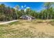 Beautiful single-Gathering house featuring a modern design, surrounded by trees, with a long driveway at 102 Kerda St, Taylorsville, NC 28681
