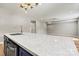 Bright kitchen features a large island with a white countertop and stainless steel appliances at 102 Kerda St, Taylorsville, NC 28681