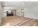 An open concept with wood floors connecting the kitchen, dining and living room at 102 Kerda St, Taylorsville, NC 28681
