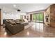 Entertaining basement featuring a wet bar, pool table, fireplace, and sliding doors to the outside at 10723 Green Heron Ct, Charlotte, NC 28278
