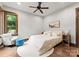 Bright bedroom featuring natural light, neutral decor, and comfortable seating at 10723 Green Heron Ct, Charlotte, NC 28278