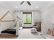 Cozy bedroom with decorative play tents, chair and ample natural light at 10723 Green Heron Ct, Charlotte, NC 28278