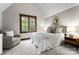 Serene bedroom featuring neutral colors, natural light, and comfortable furnishings at 10723 Green Heron Ct, Charlotte, NC 28278