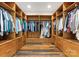 Large walk-in closet with custom shelving, ample storage, and hardwood floors at 10723 Green Heron Ct, Charlotte, NC 28278