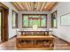 Bright dining room featuring a rustic ceiling, large windows, and wood accents at 10723 Green Heron Ct, Charlotte, NC 28278