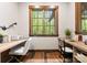 Bright home office featuring hardwood floors, two desks and a large window at 10723 Green Heron Ct, Charlotte, NC 28278