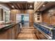 Modern kitchen featuring stainless steel appliances, custom cabinets, stone accents, and a functional layout at 10723 Green Heron Ct, Charlotte, NC 28278