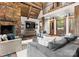 Inviting living room featuring a stone fireplace, comfortable seating, and stylish decor with access to a loft at 10723 Green Heron Ct, Charlotte, NC 28278