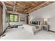 Serene main bedroom with plush carpet, wooden ceiling and bright window overlooking the yard at 10723 Green Heron Ct, Charlotte, NC 28278