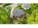 Aerial view of charming home with lush green lawn, mature trees, and screened-in porch, in a desirable neighborhood at 1113 Urban Pl, Charlotte, NC 28209