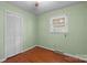 This bedroom features a window for natural light, wooden floors, and a closet for storage at 1113 Urban Pl, Charlotte, NC 28209