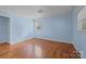 Cozy bedroom with neutral paint, hardwood floors, and a window at 1113 Urban Pl, Charlotte, NC 28209