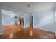 Spacious living room features a brick fireplace and hardwood floors at 1113 Urban Pl, Charlotte, NC 28209