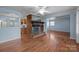 Spacious living room features a brick fireplace and hardwood floors at 1113 Urban Pl, Charlotte, NC 28209