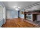 Spacious living room features a brick fireplace and hardwood floors at 1113 Urban Pl, Charlotte, NC 28209